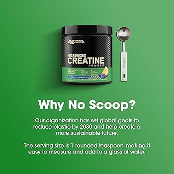 Burk med smaksatt kreatin från Optimum Nutrition bredvid en tesked på grön bakgrund.